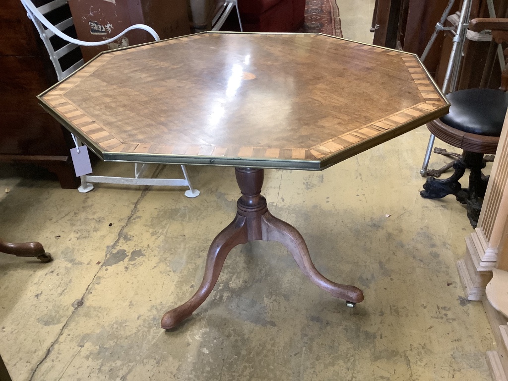 Two similar George III parquetry inlaid mahogany octagonal tilt top tables, width 96cm, height 73cm